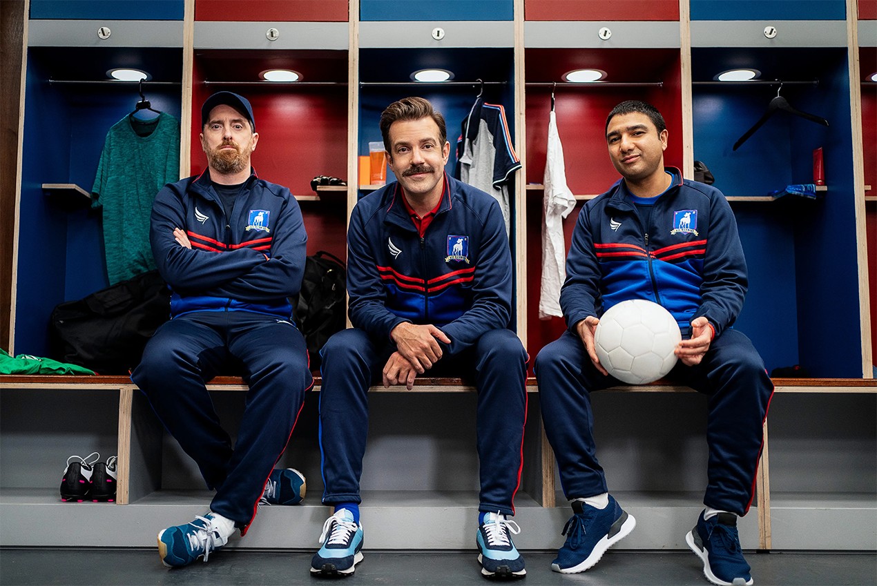 Coach Beard, Ted, and Nate in the locker room